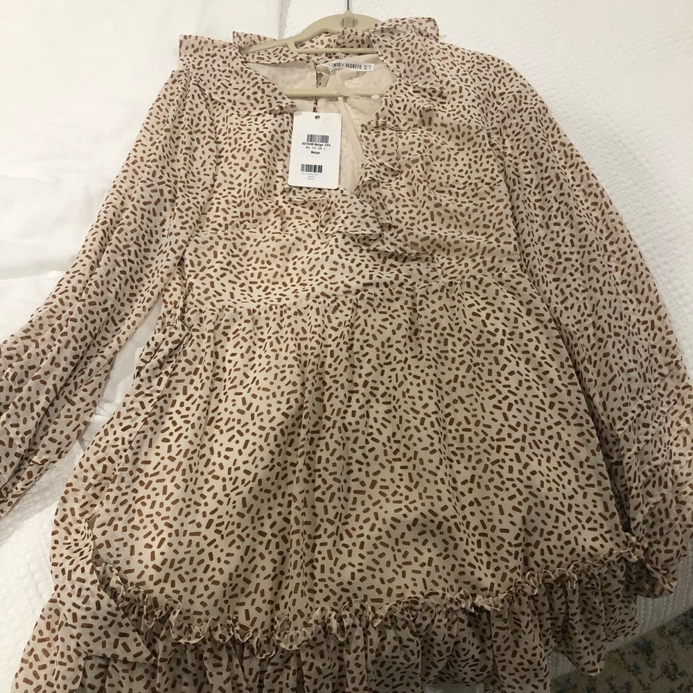 Spotted ruffle wrap dress